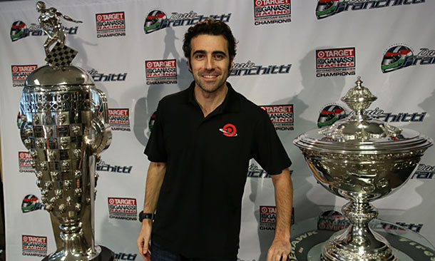 Dario Franchitti with the Astor Cup, right, and Borg-Warner Trophy, left